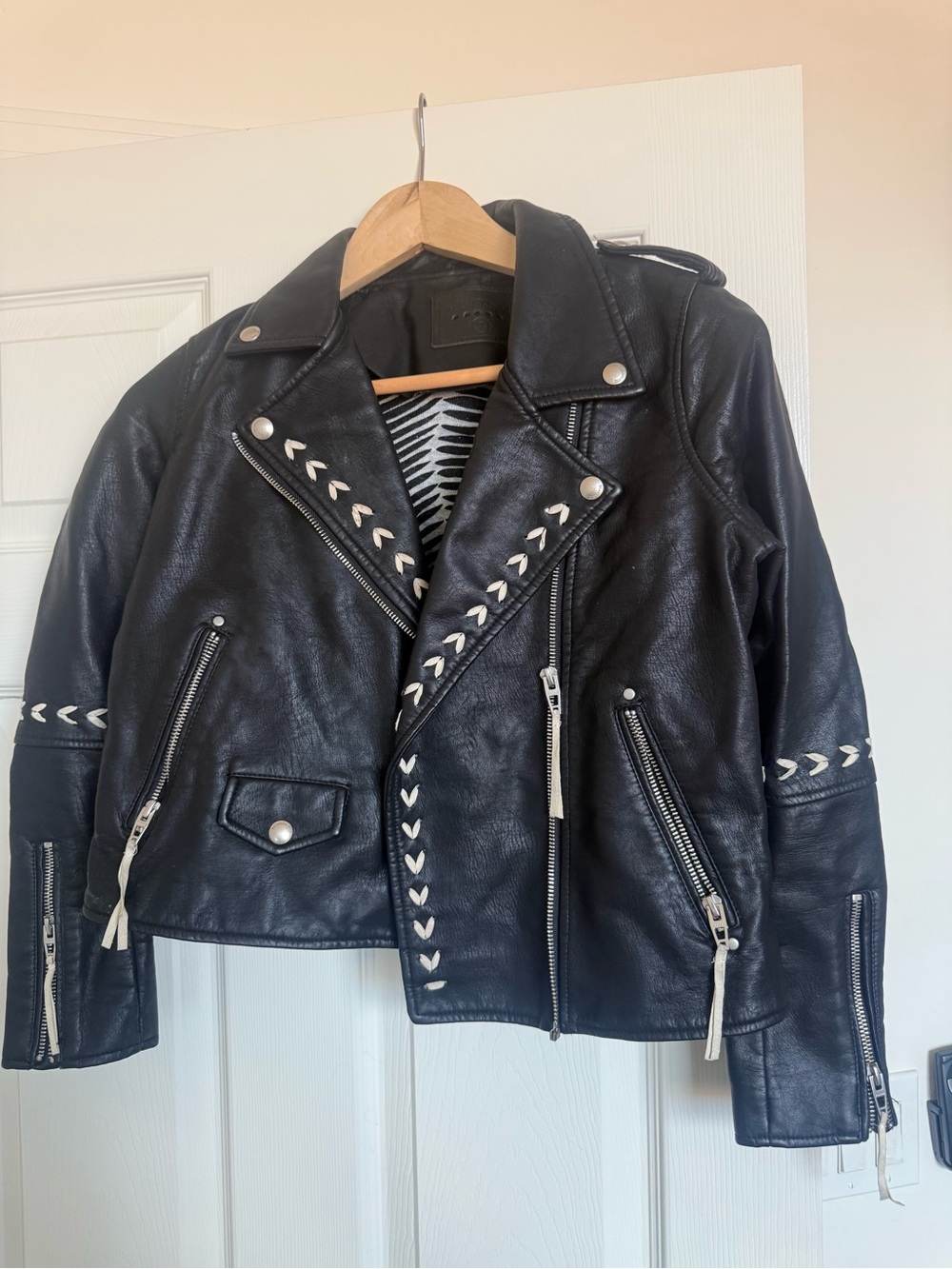 Blank NYC Black Leather Jacket with White Zebra-Style Lining